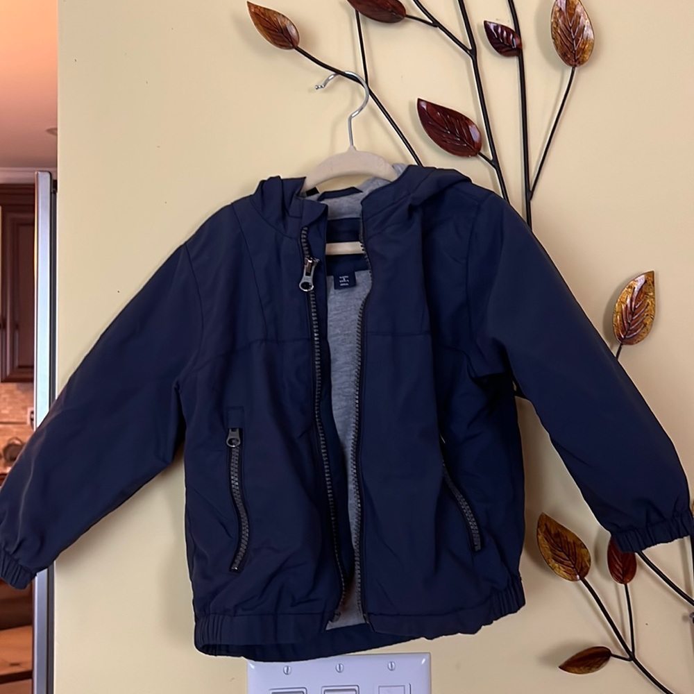 Windbreaker jacket with hoodie and fleece lining